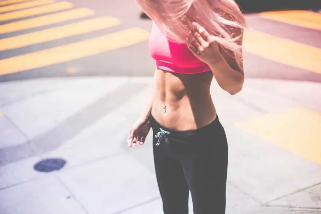 Woman with toned stomach after LA-EMS Body Sculpting Treatment Matlock